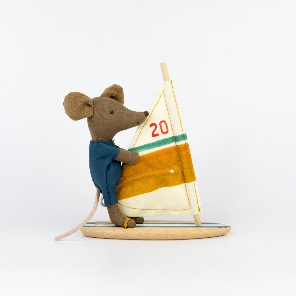 Stuffed mouse with a sailboat on a white background