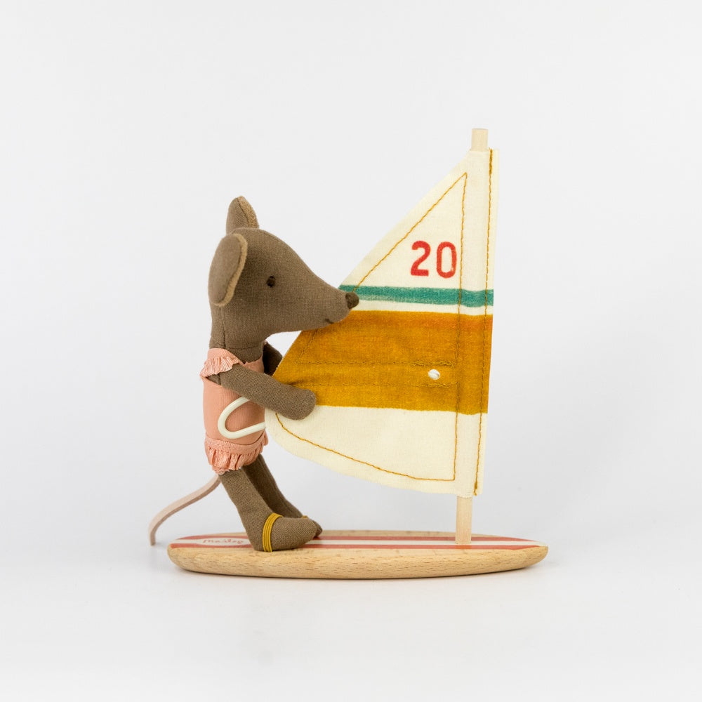 Stuffed toy mouse with a sailboat on a white background