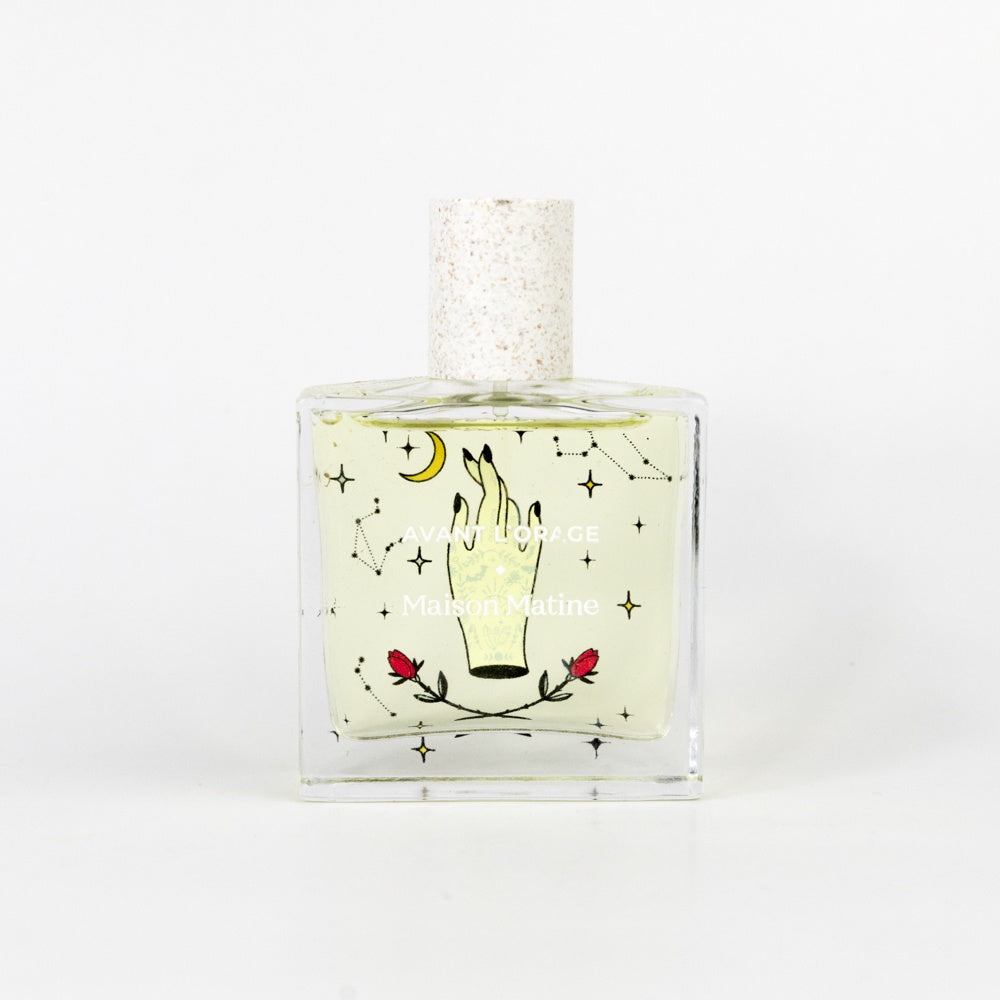 Perfume bottle with decorative label on a white background