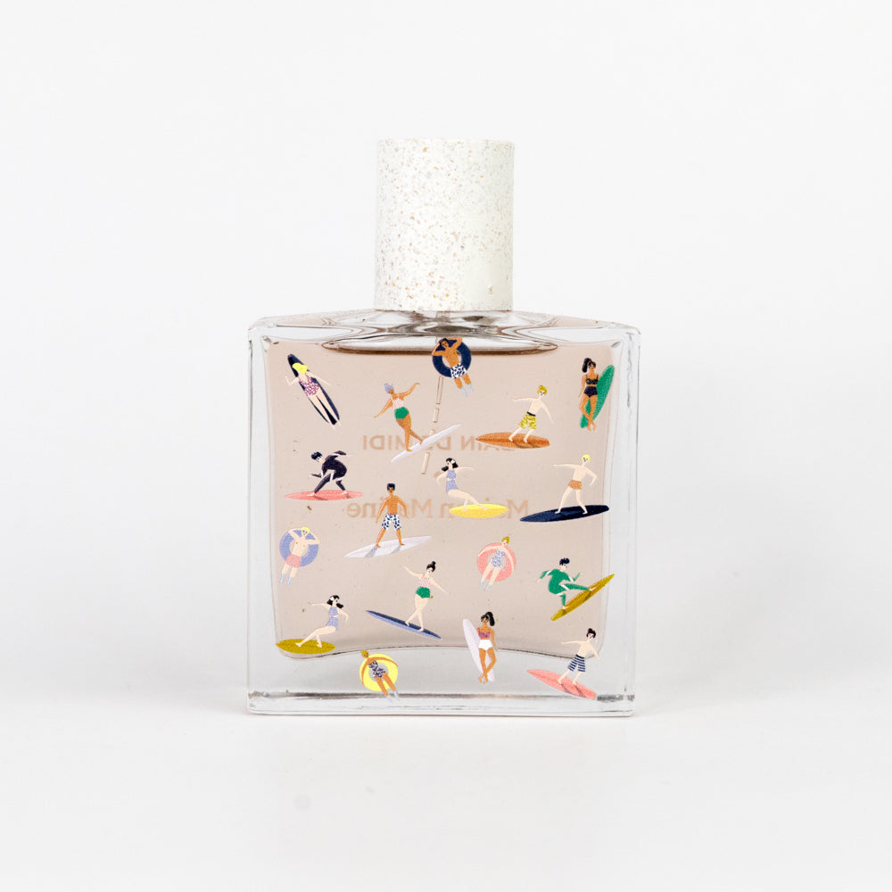 Perfume bottle with beach-themed illustrations on a white background