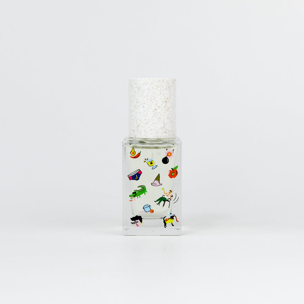Clear glass bottle with colorful stickers on a white background