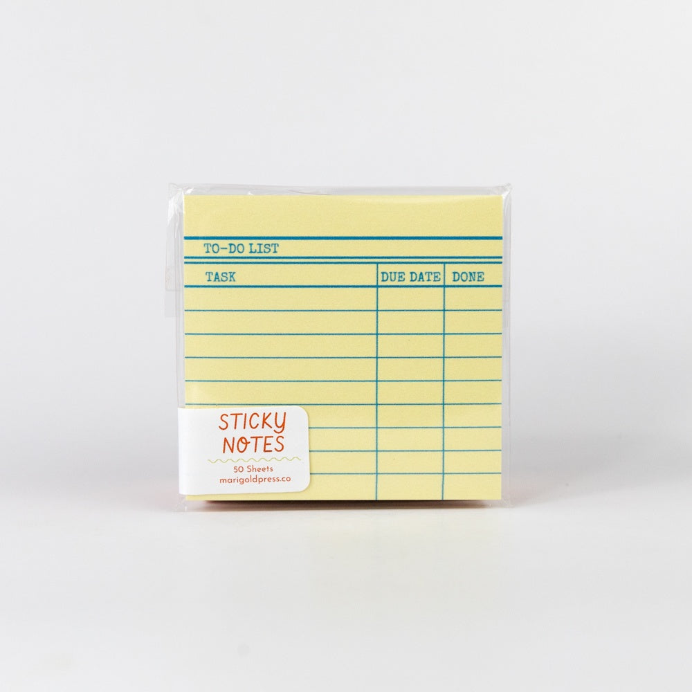 Yellow sticky notes pad with grid layout on a white background