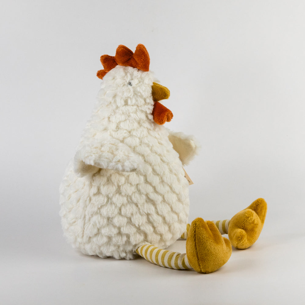 Plush toy chicken with a white body, orange head, and yellow feet on a light gray background