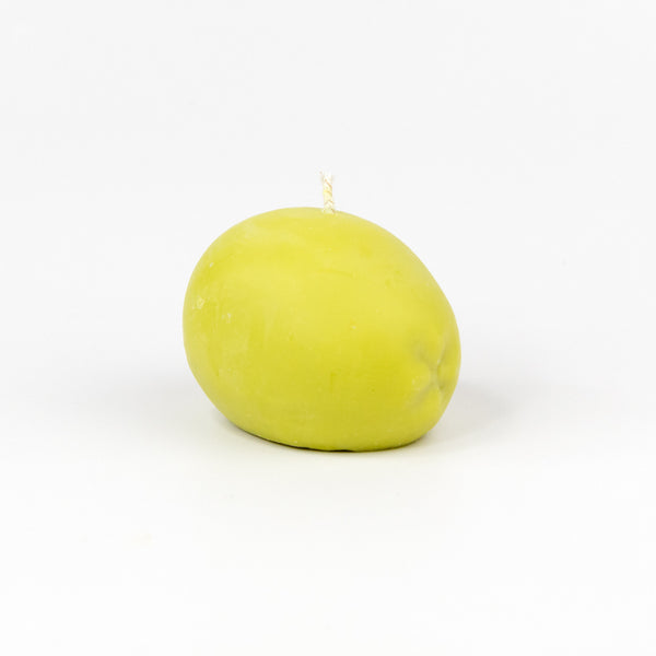 A green olive shaped candle