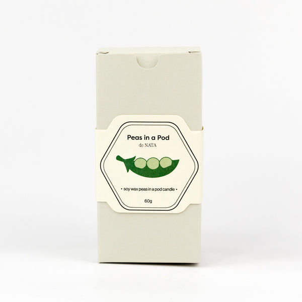 Product packaging of 'Peas in a Pod' candle on a white background