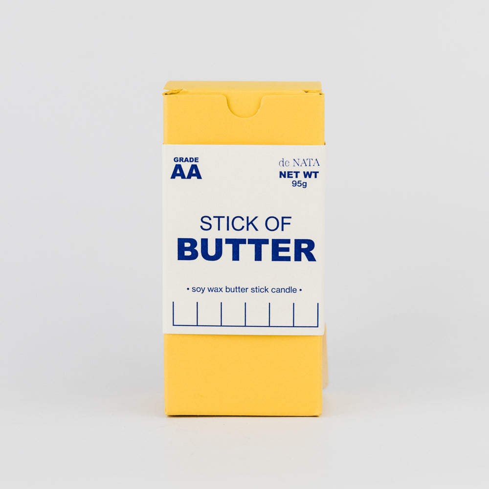Rectangular candle with 'BUTTER' text on a light gray background