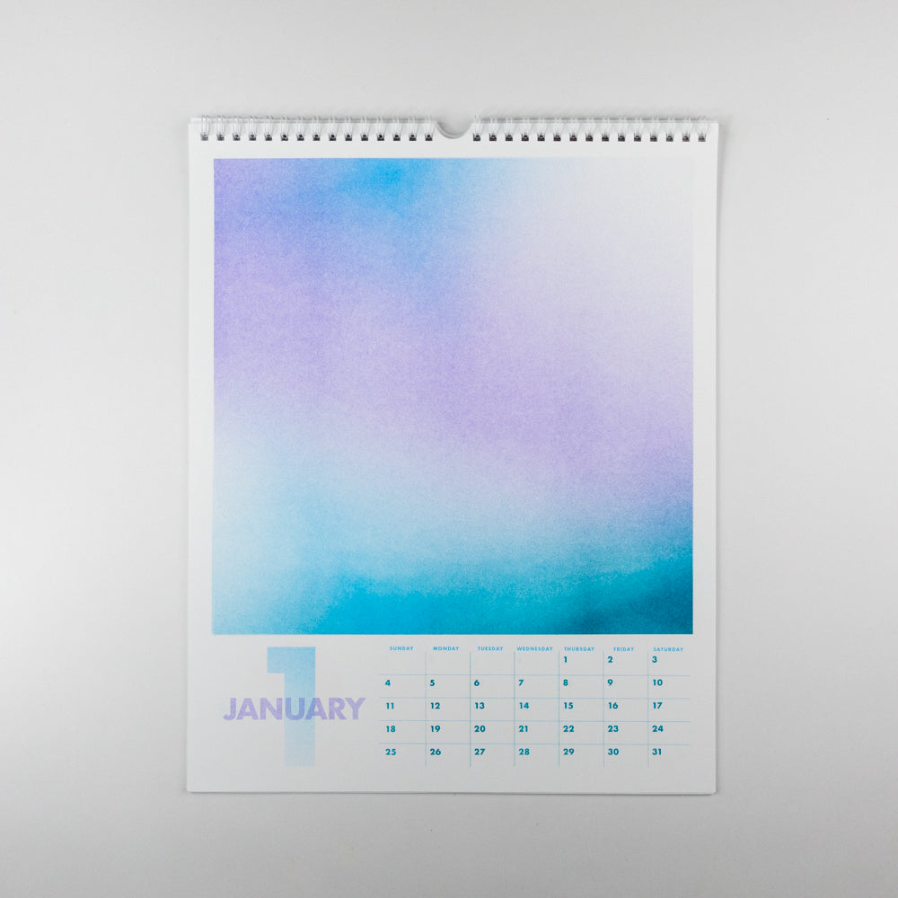 Wall calendar with a gradient blue and purple design on a white background