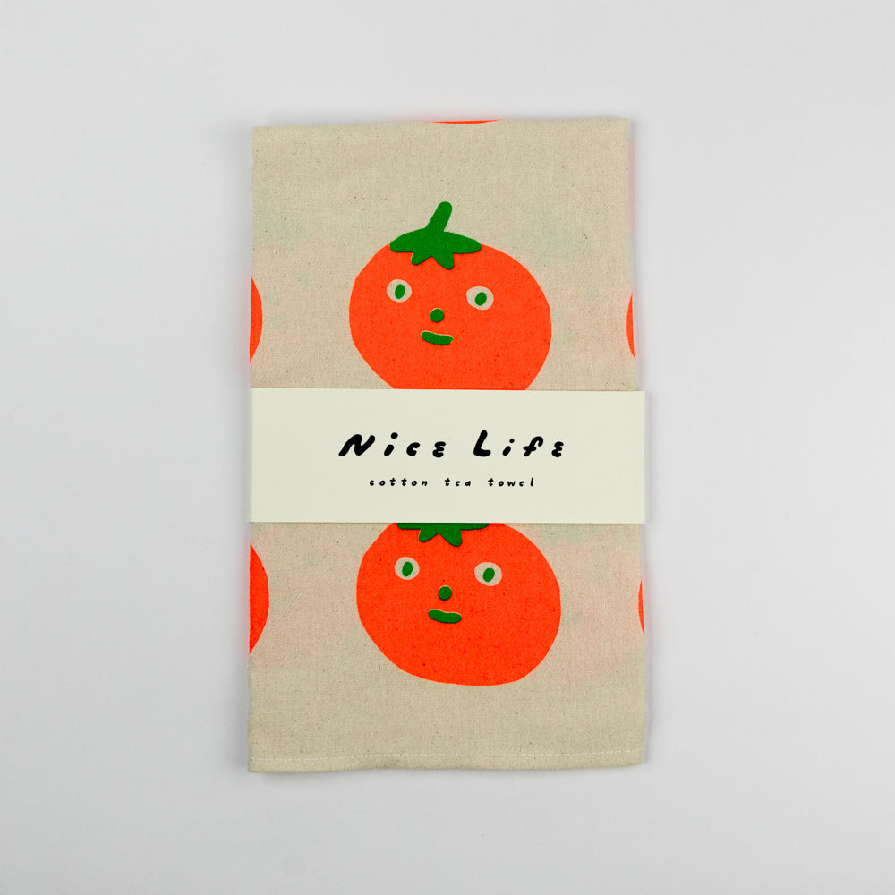 Beige fabric with red tomatoes with faces printed on a white background