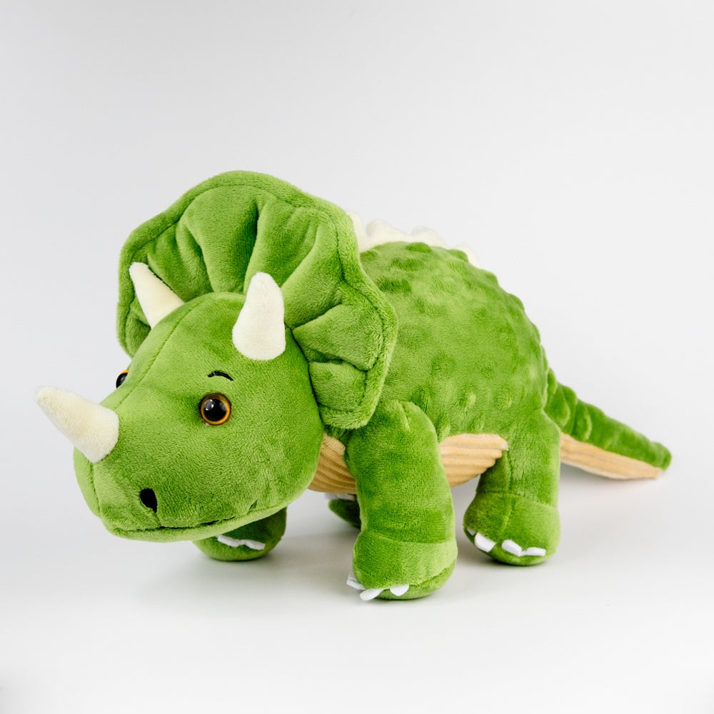 Green plush triceratops toy on a white background