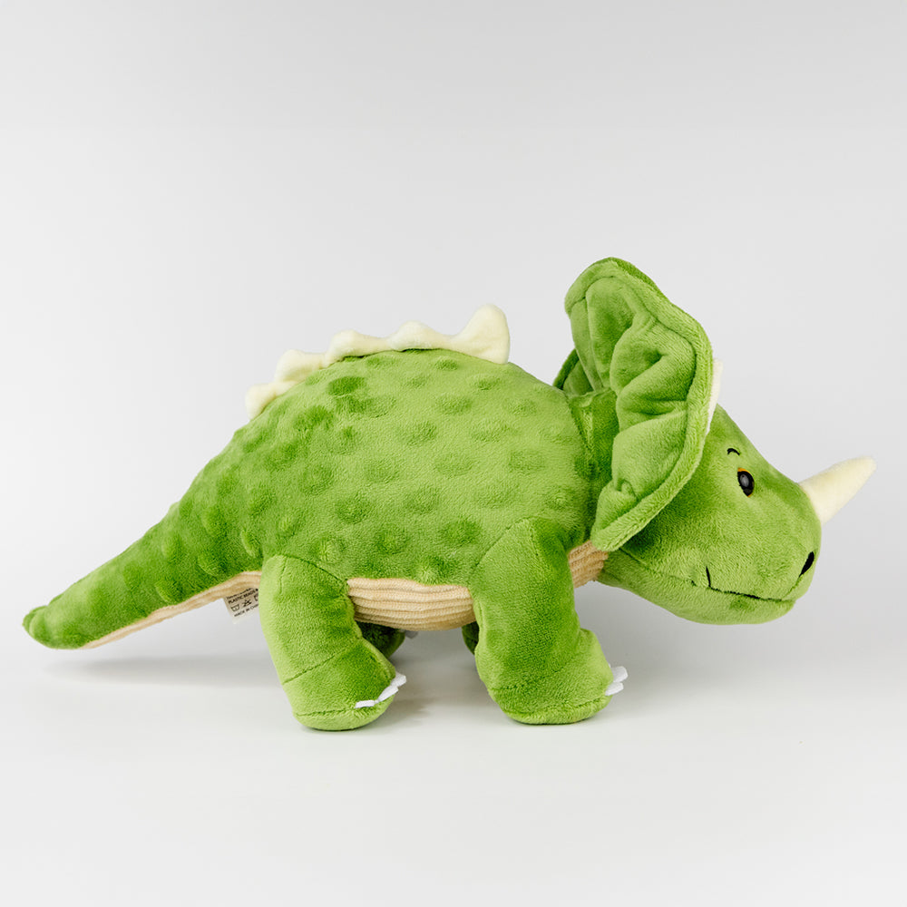 Green plush triceratops toy on a white background