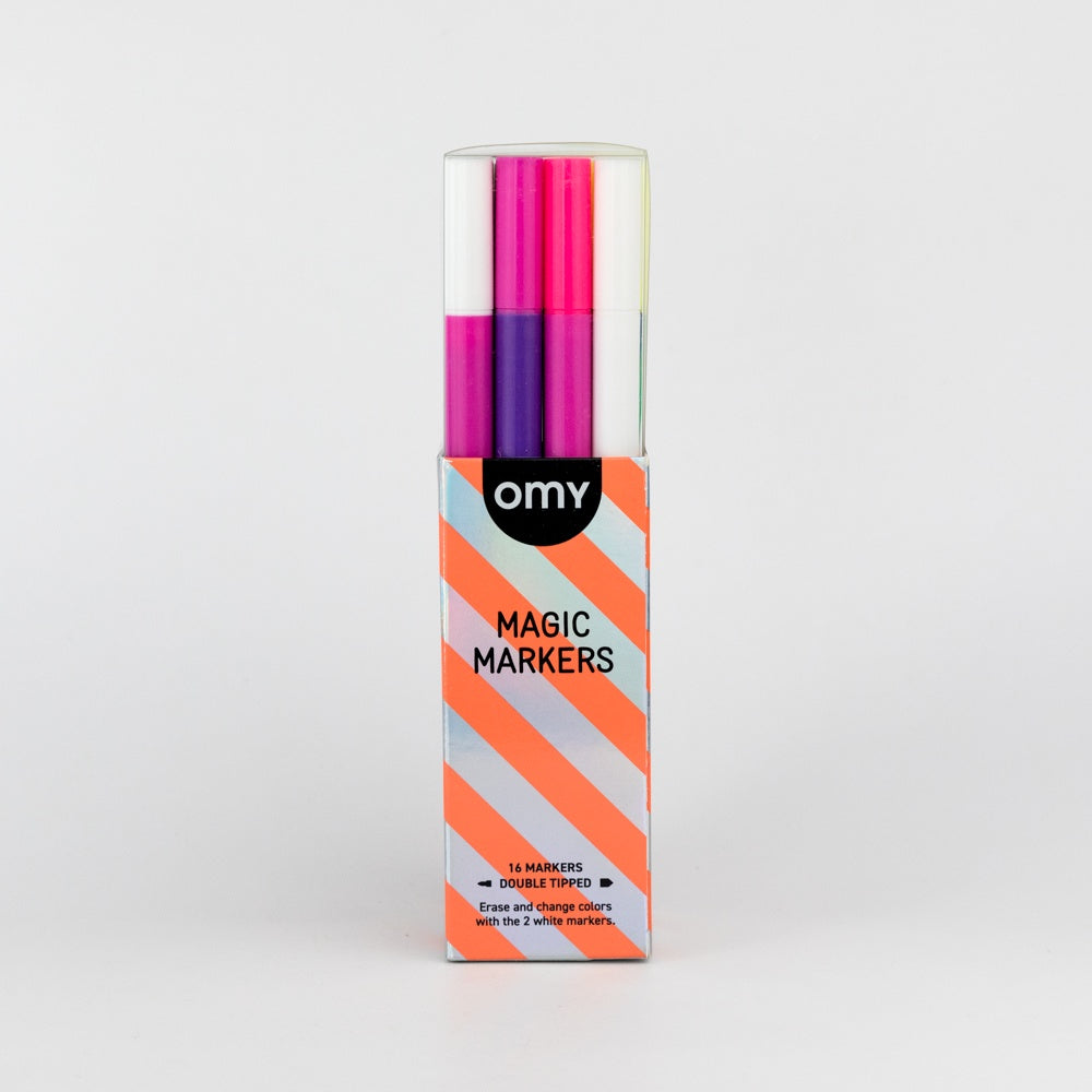 Box of OMY Magic Markers with colorful markers inside on a light gray background