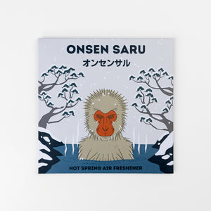 Onsen Saru hot spring air freshener packaging with a monkey illustration on a light blue background.