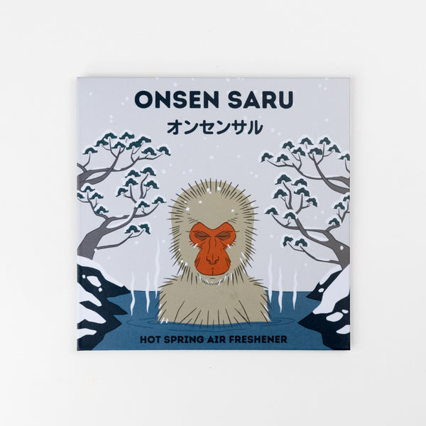Onsen Saru hot spring air freshener packaging with a monkey illustration on a light blue background.