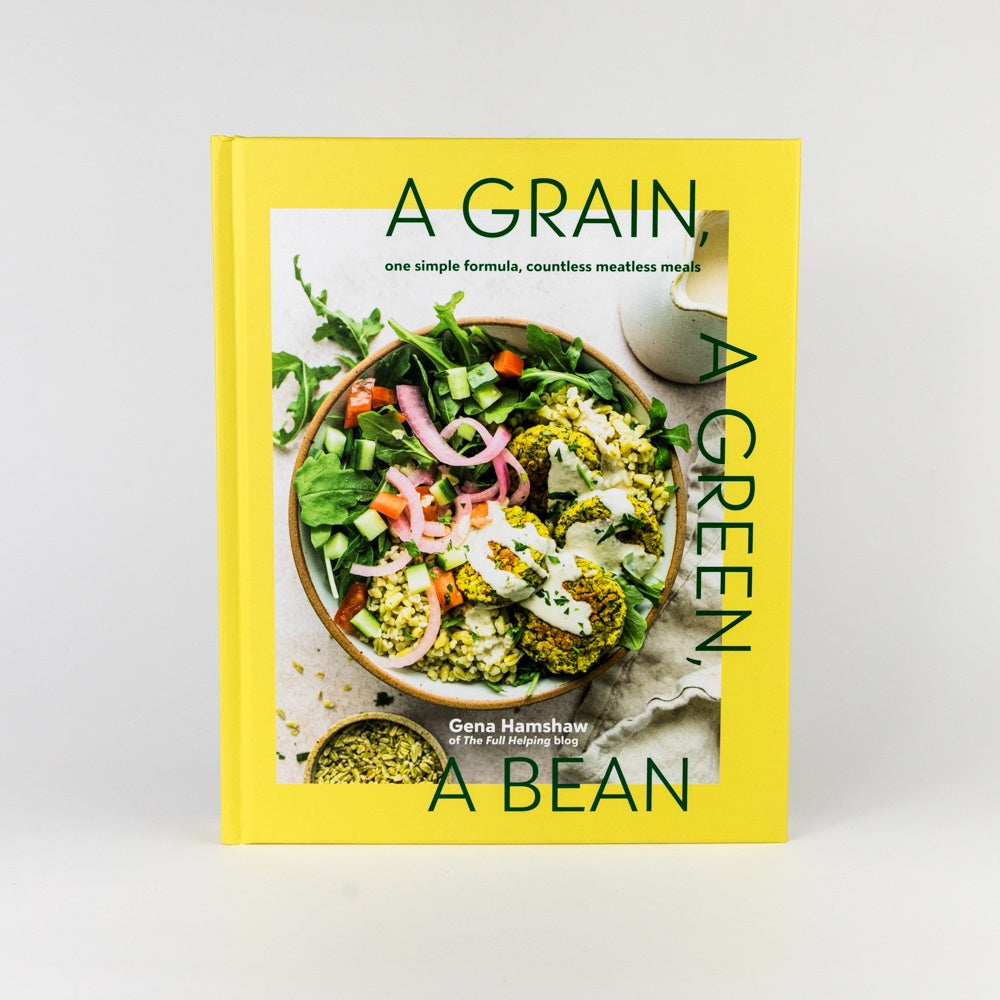 Book cover of 'A Grain, A Green, A Bean' with a bowl of salad on a yellow background