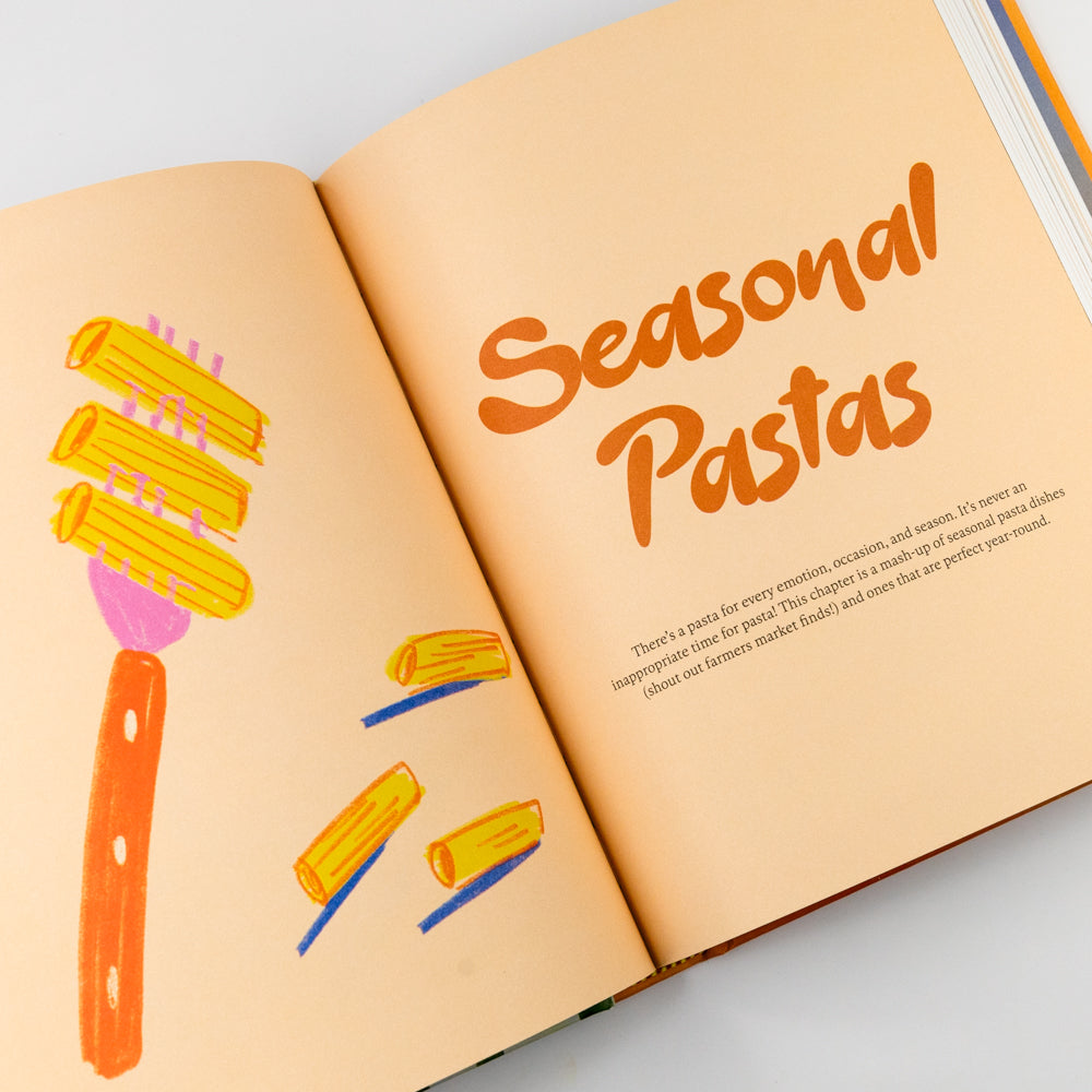 Open book with 'Seasonal Pastas' title and illustrations on a light background