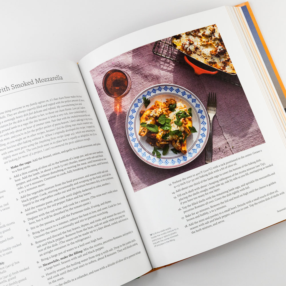 Book titled 'By Heart' with colorful illustrations on an orange background