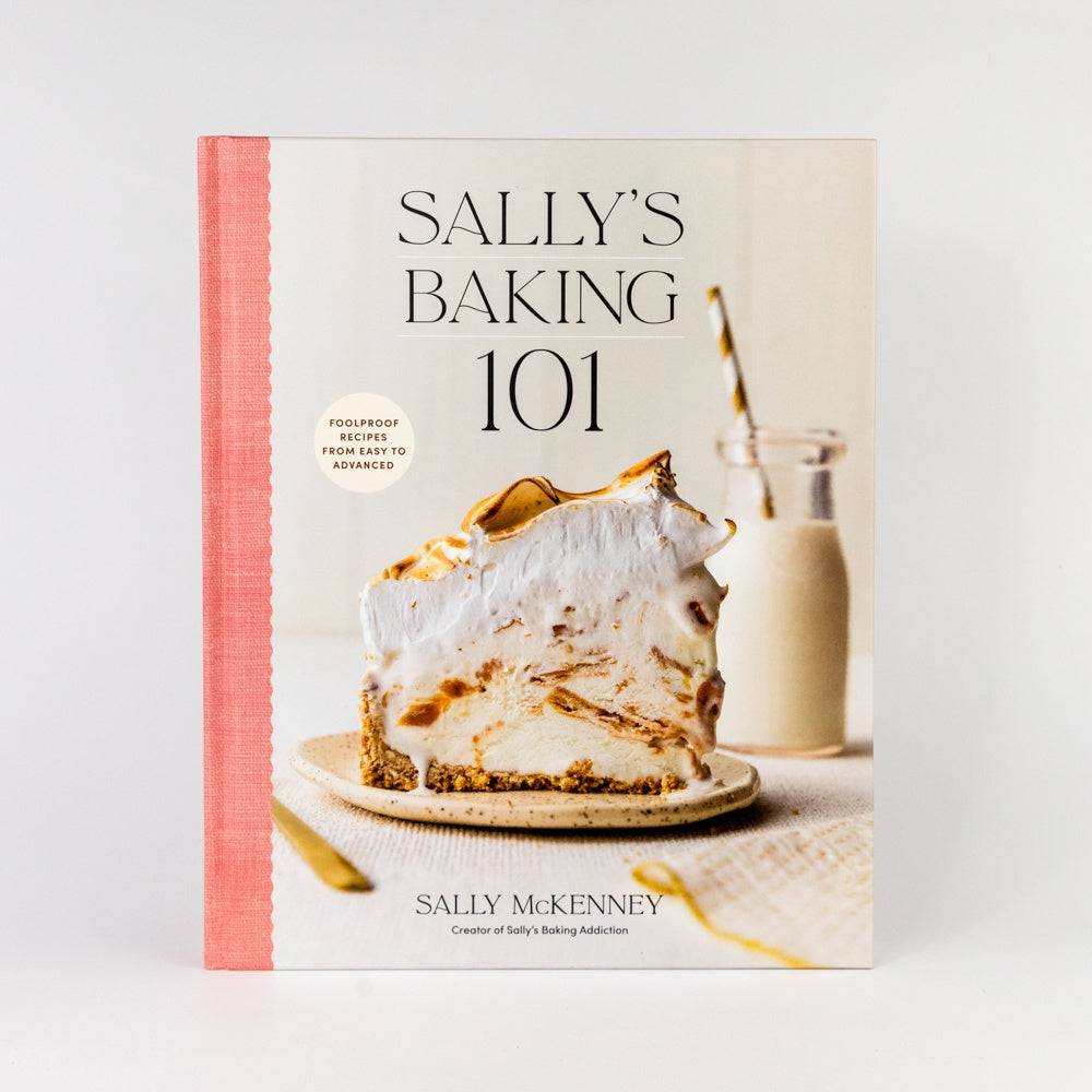 Cookbook titled 'Sally's Baking 101' with a cake and milk bottle on the cover