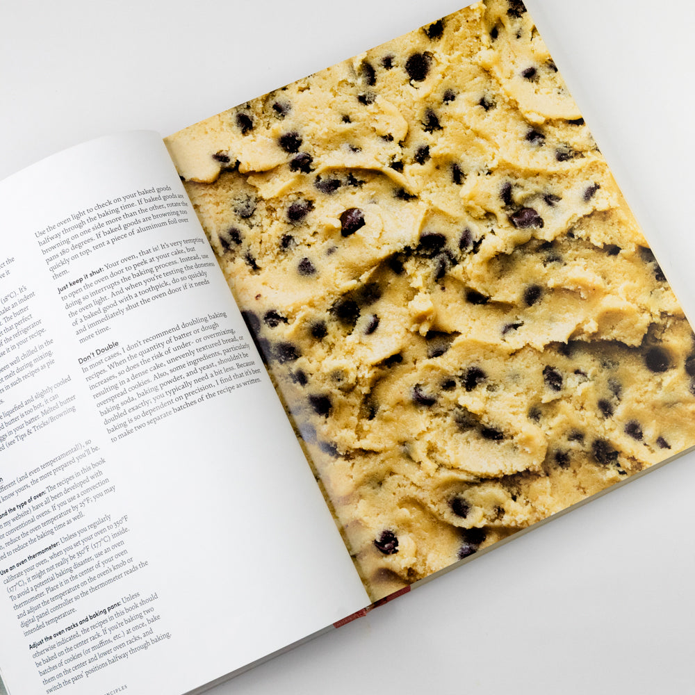 Book with cookie dough on top, showing text inside