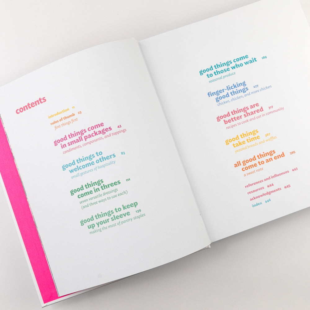 Open book with colorful text on a white background