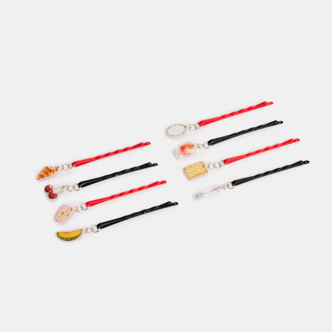 Set of decorative hair sticks with various charms on a white background