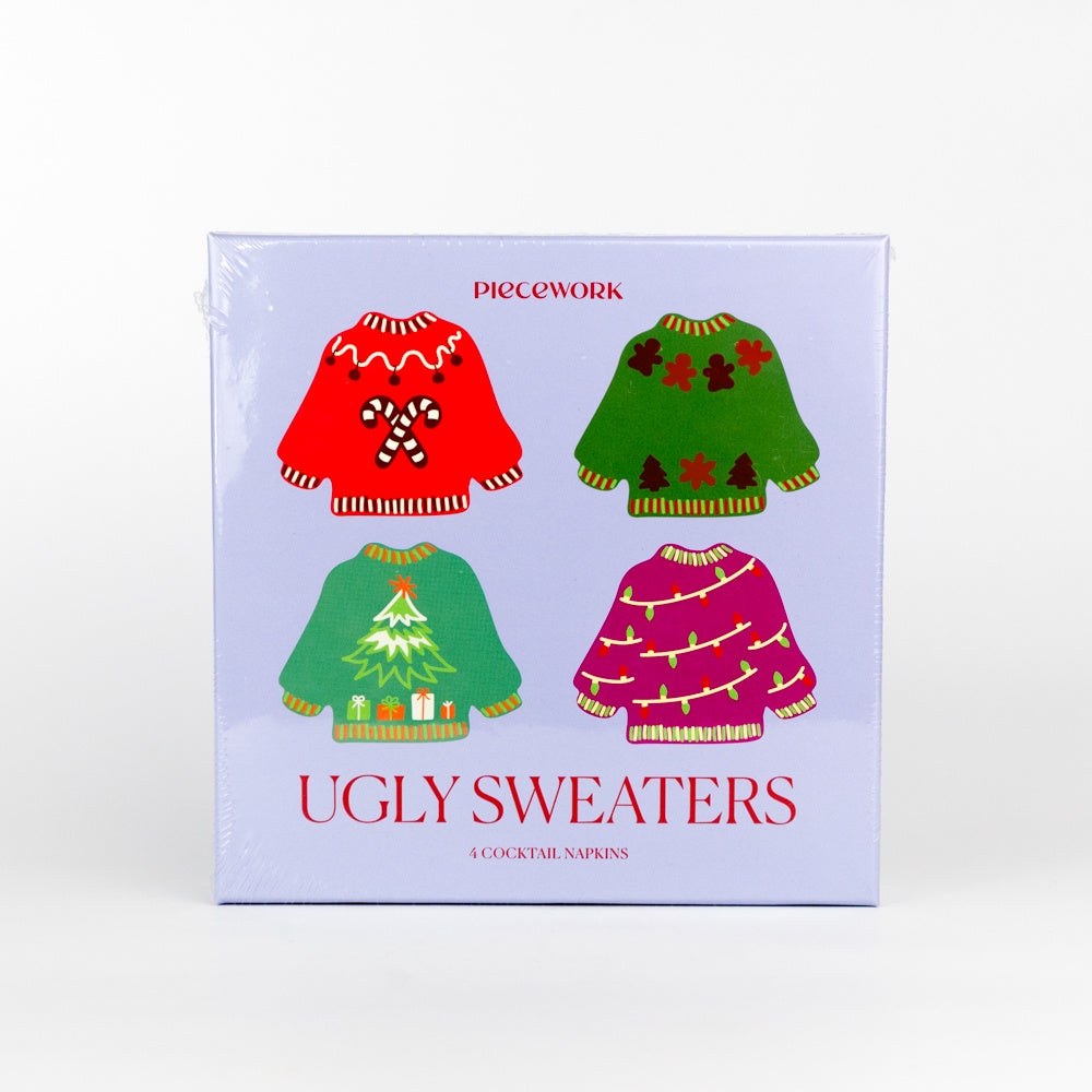 Pack of cocktail napkins with Christmas-themed ugly sweaters on a white background