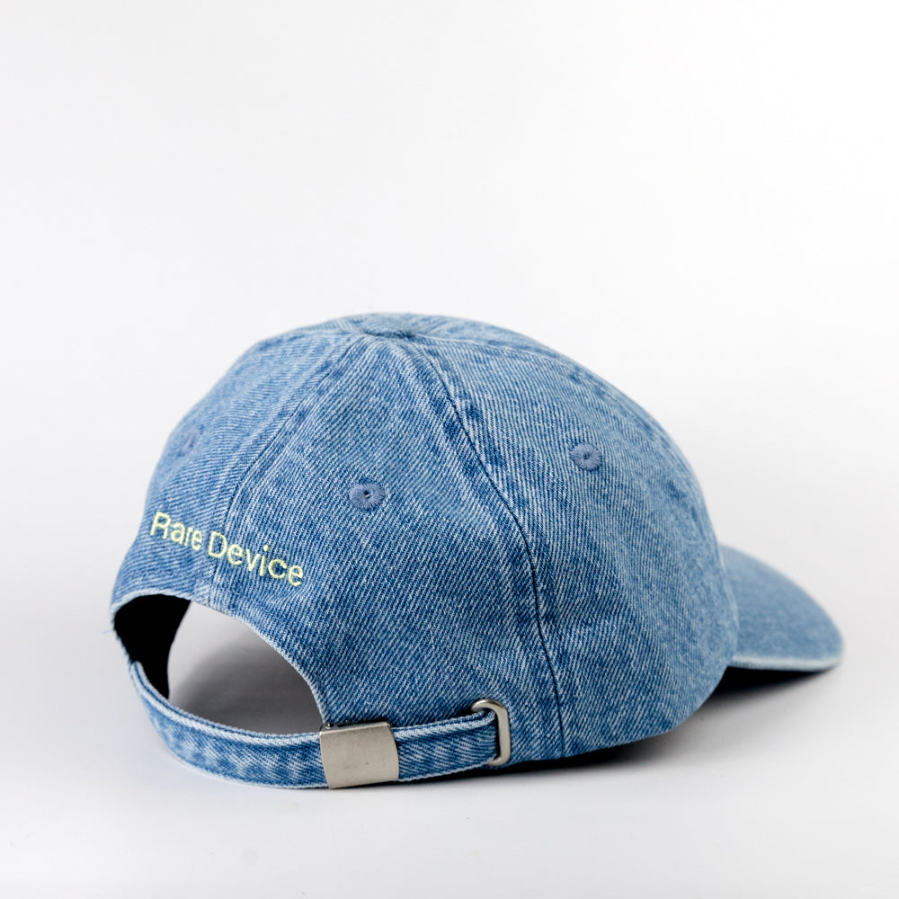 Blue denim cap with 'Rate Device' logo on a white background