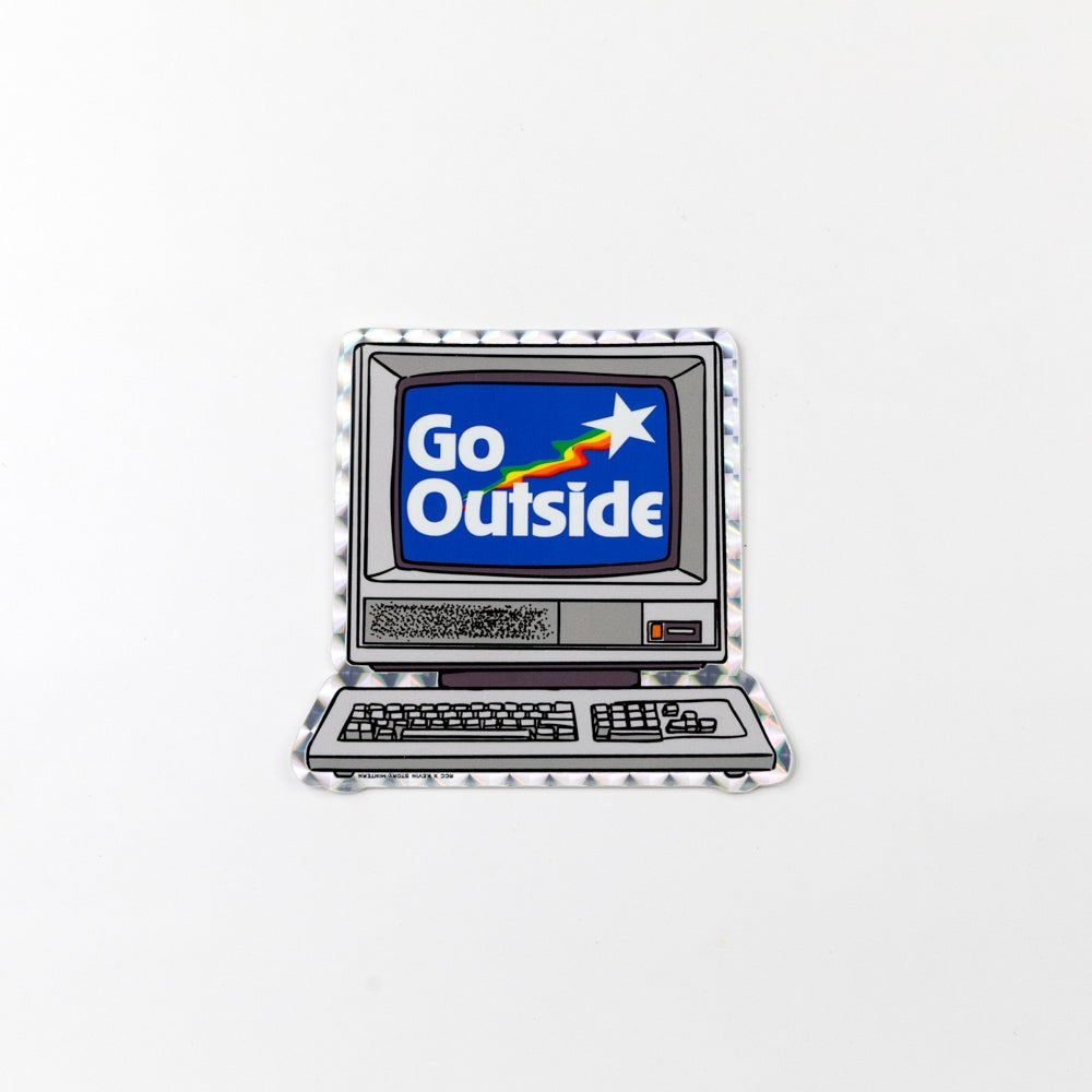 Vintage computer with 'Go Outside' message on screen against a white background
