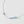Necklace with a blue gemstone on a light gray background
