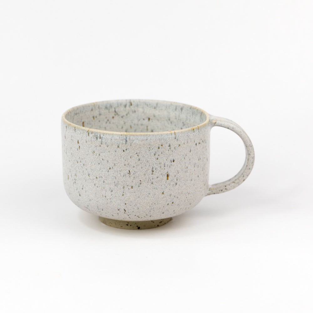 Speckled gray ceramic mug on a white background