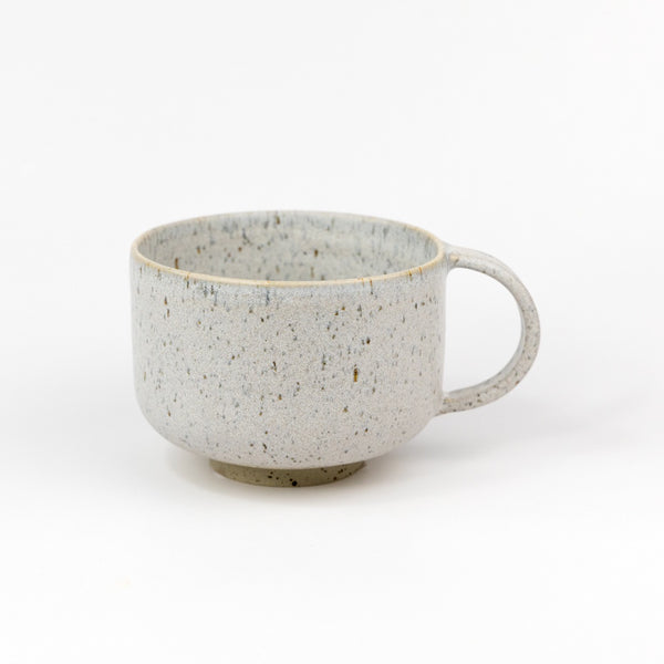 Speckled gray ceramic mug on a white background
