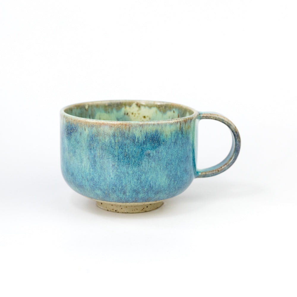 Blue ceramic mug on a white background