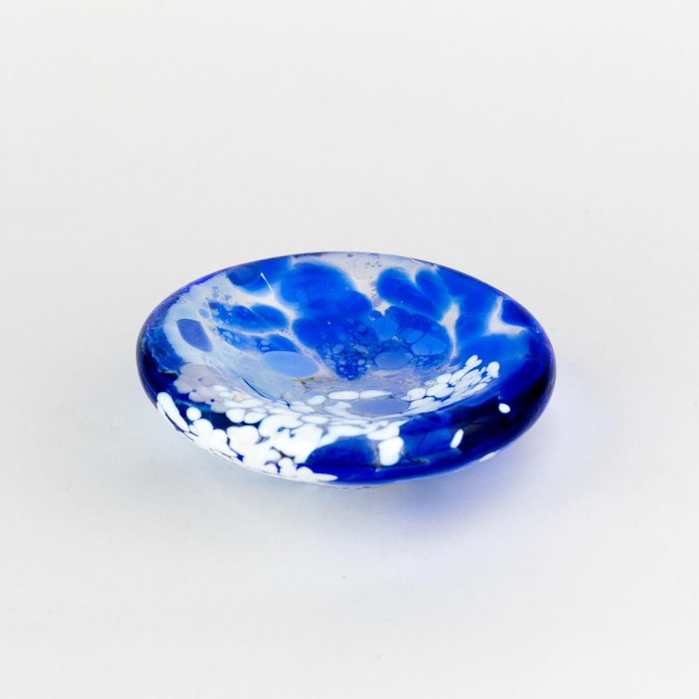 Blue and white glass dish on a light gray background