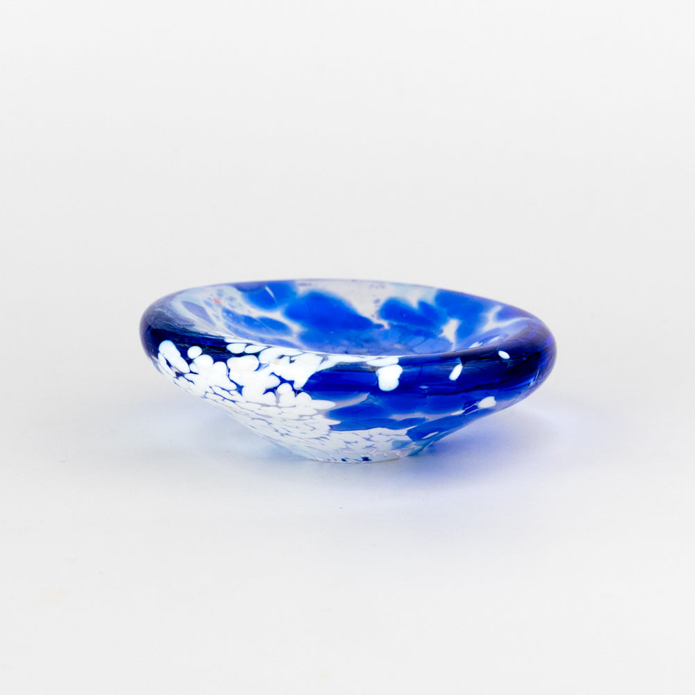 Blue and white glass dish on a light gray background