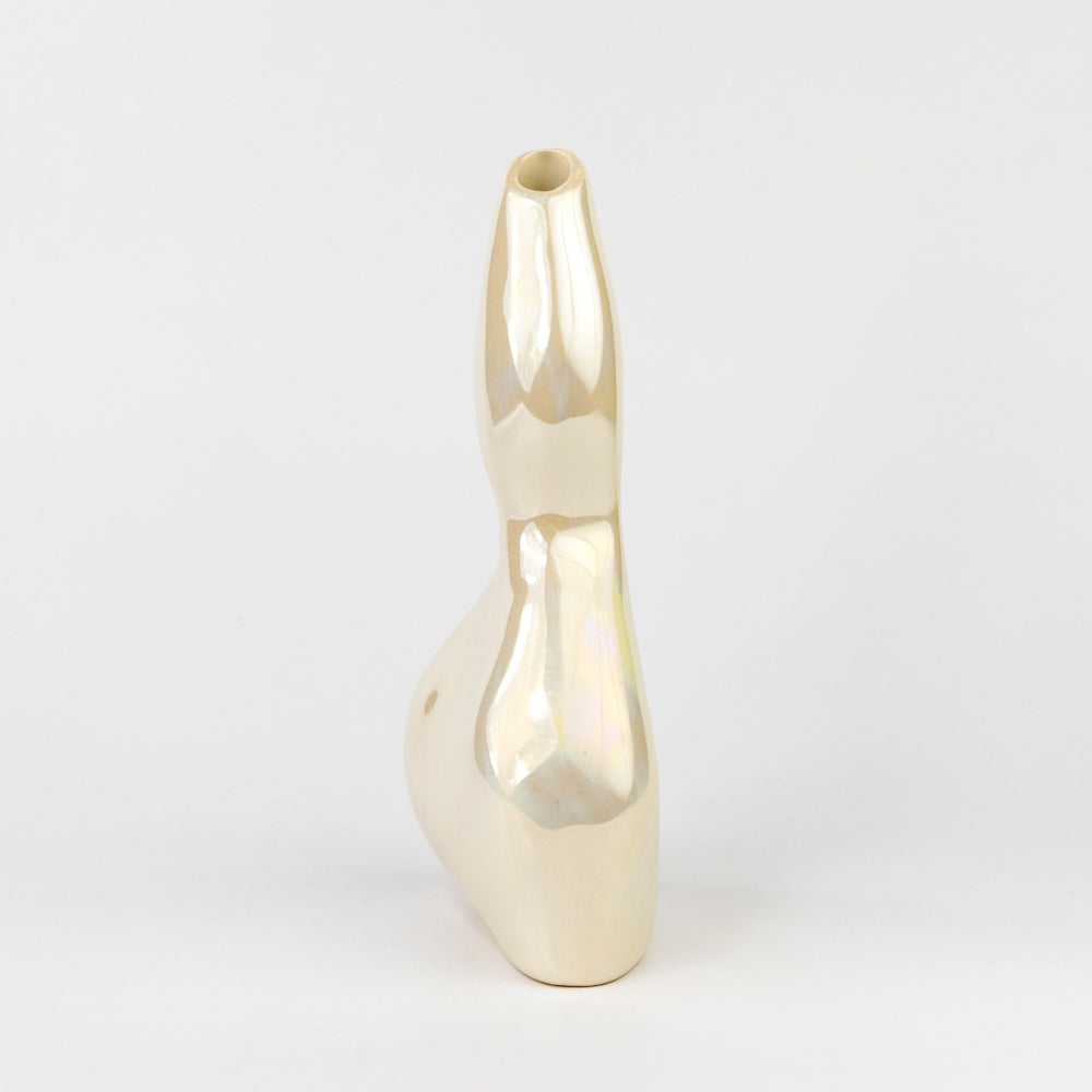 Iridescent-colored vase on a light gray background