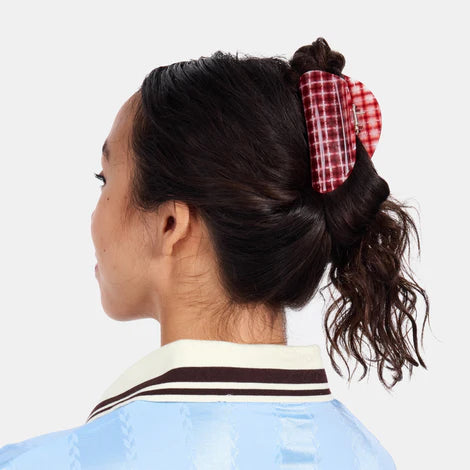 Red and white checkered hair claw on a white background