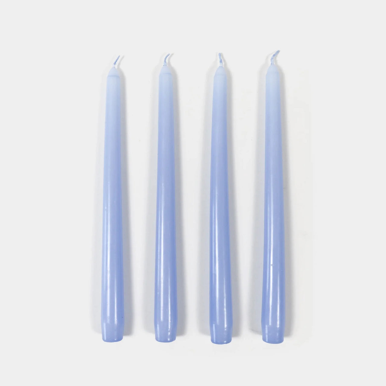 Four lavender candles on a white background
