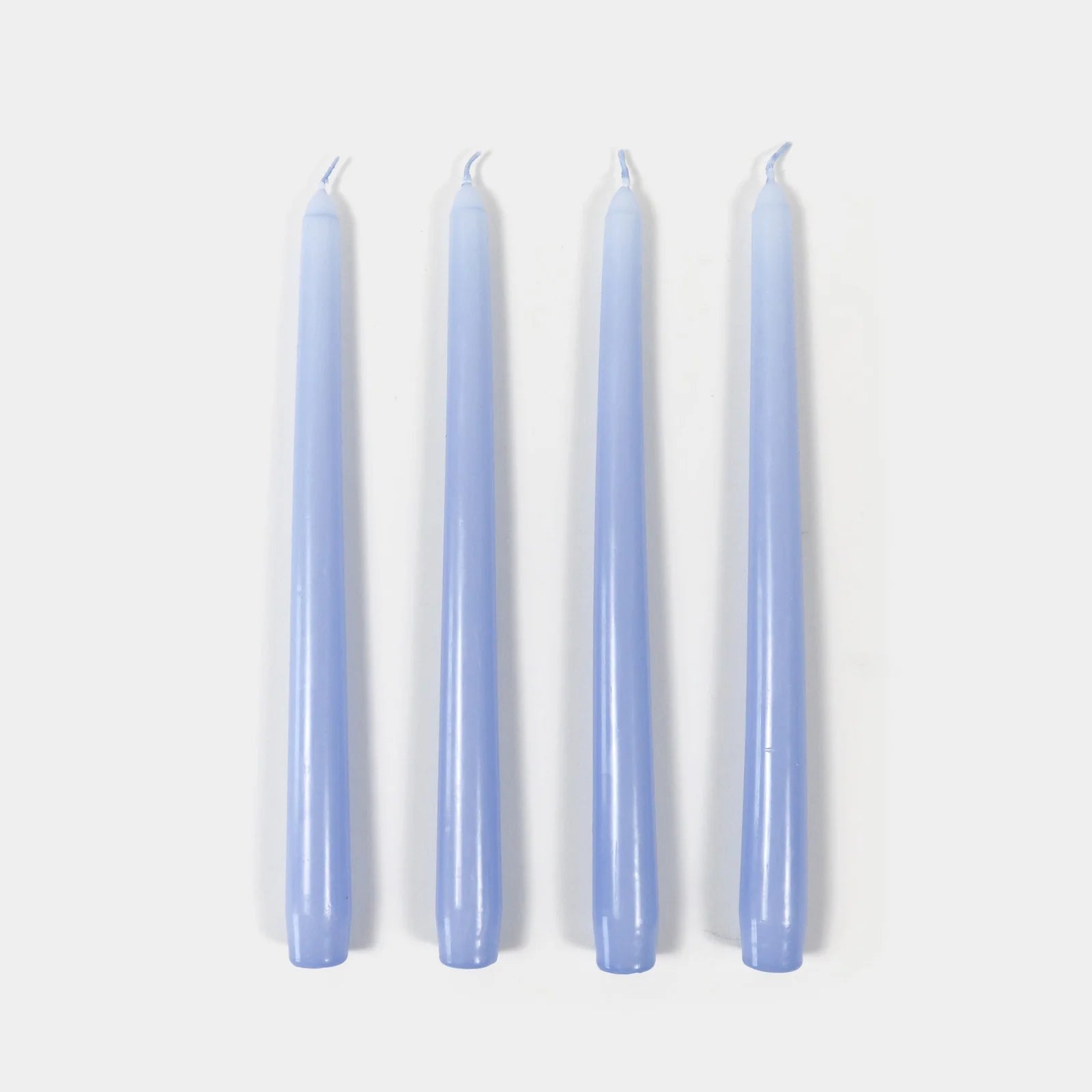 Four lavender candles on a white background