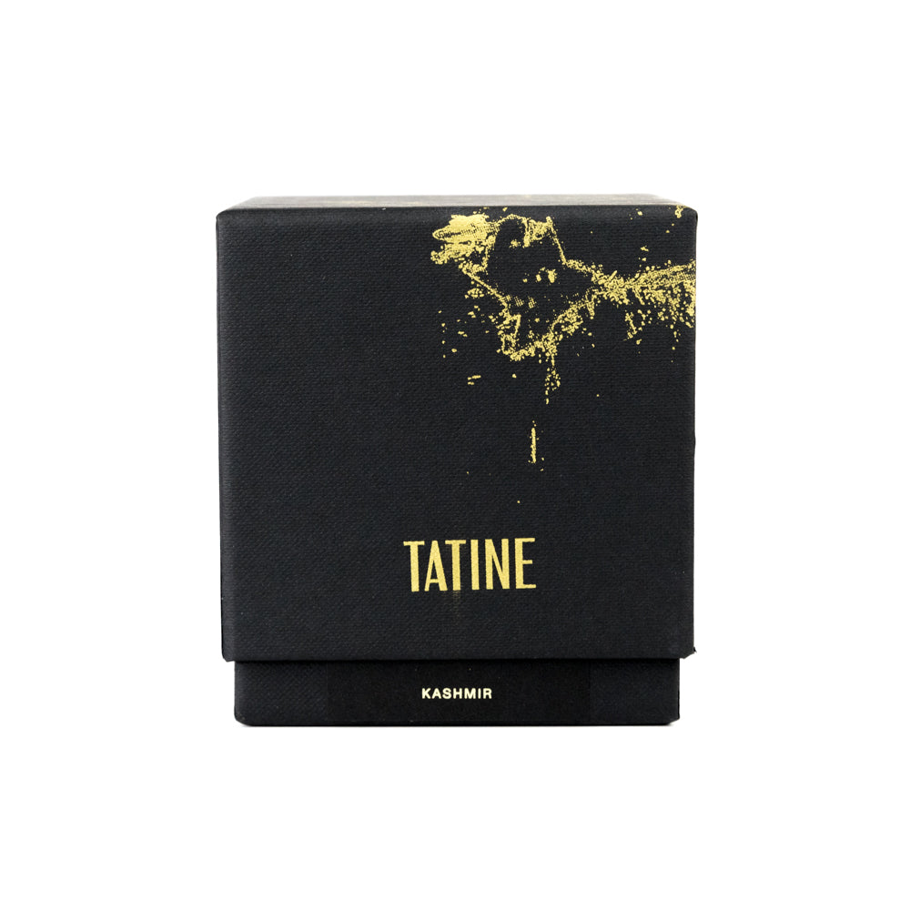 Black box with gold text and design on a white background