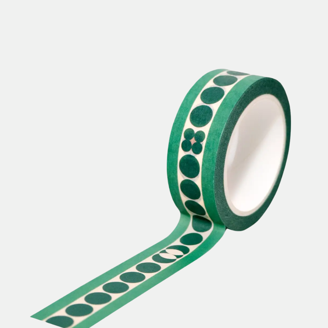 Green tape with black circular pattern on a white background