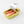 tinned candle designed to look like a  Sardine can with the top peeled back to expose sardine shapes in the wax on a white background
