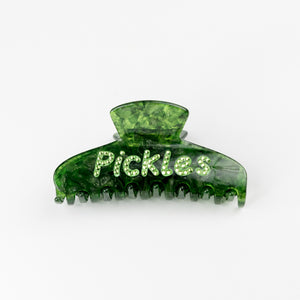 Green hair clip with 'Pickles' rhinestone text on a white background