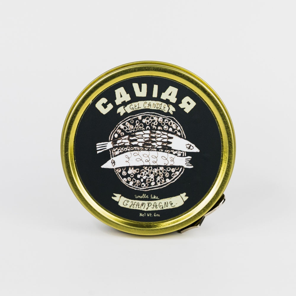 Caviar container lid with gold rim and black label on a white background