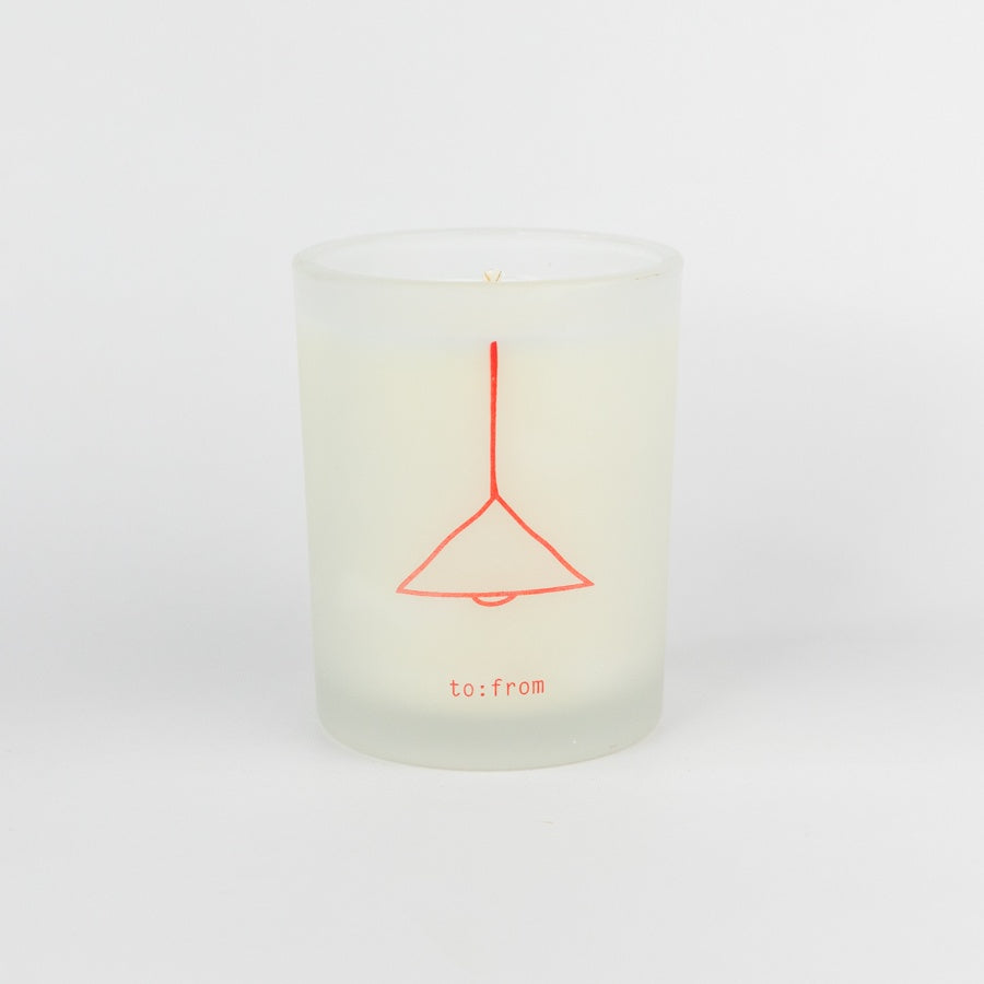 Candle with a red design and text on a white background