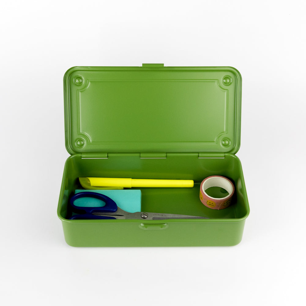 Green box with stationery items on a white background