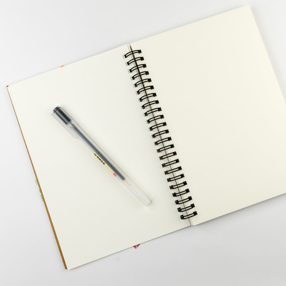 Open notebook with a pen on a white background