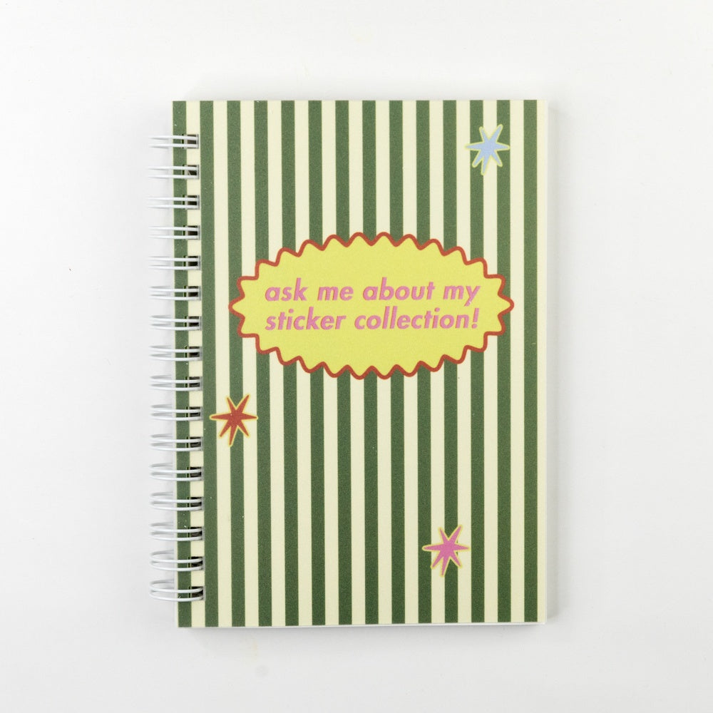 Notebook with green and white striped cover and text 'ask me about my sticker collection!' on a white background