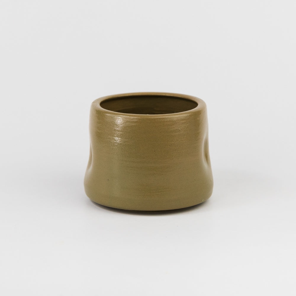 Brown ceramic cup on a white background