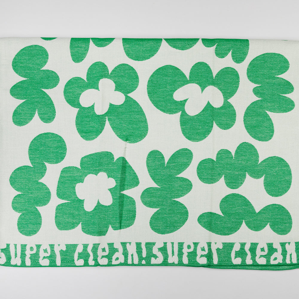 Green floral patterned towel with 'Super Clean!' text on a white background