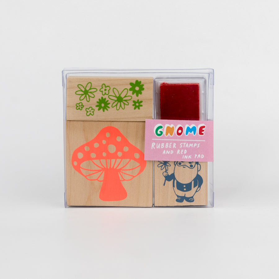 Set of rubber stamps with mushroom, flower, and gnome design on a white background