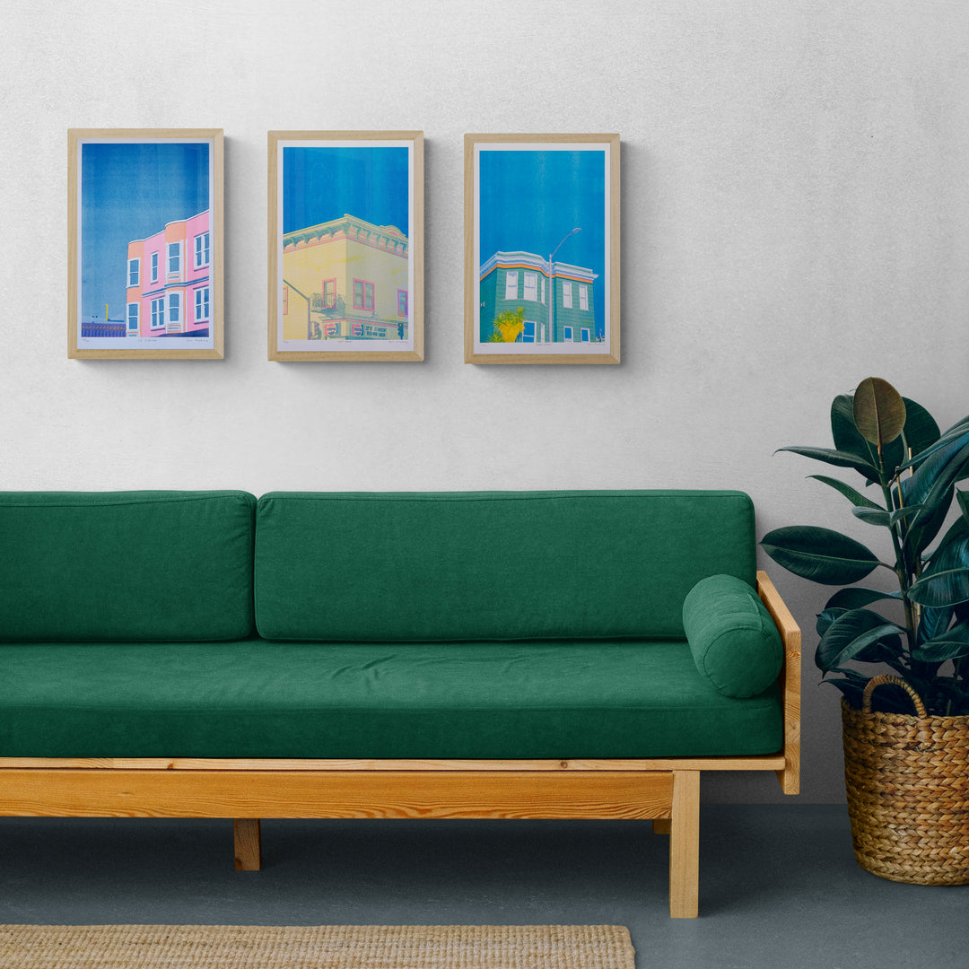 Green House Risograph Print  of a green building with a palm tree and light post in front of a very blue sky